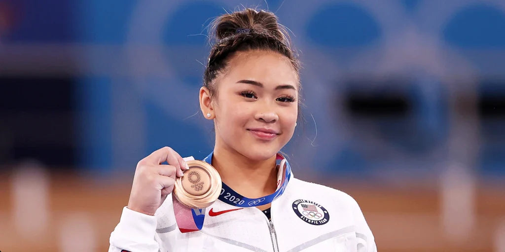 Spotlight on Suni Lee: Facing Anxiety & Impostor Syndrome En Route To Winning At The Olympics